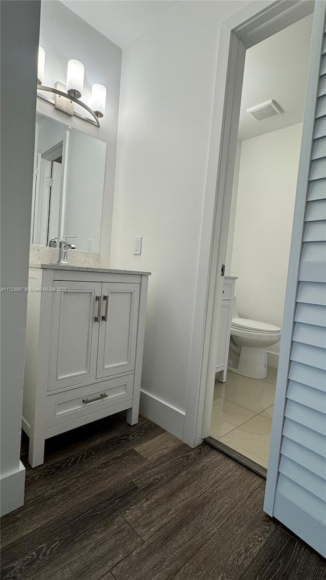 6850 NW 173rd Dr Unit 103, Hialeah, FL 33015 - bathroom featuring wood finished floors and vanity