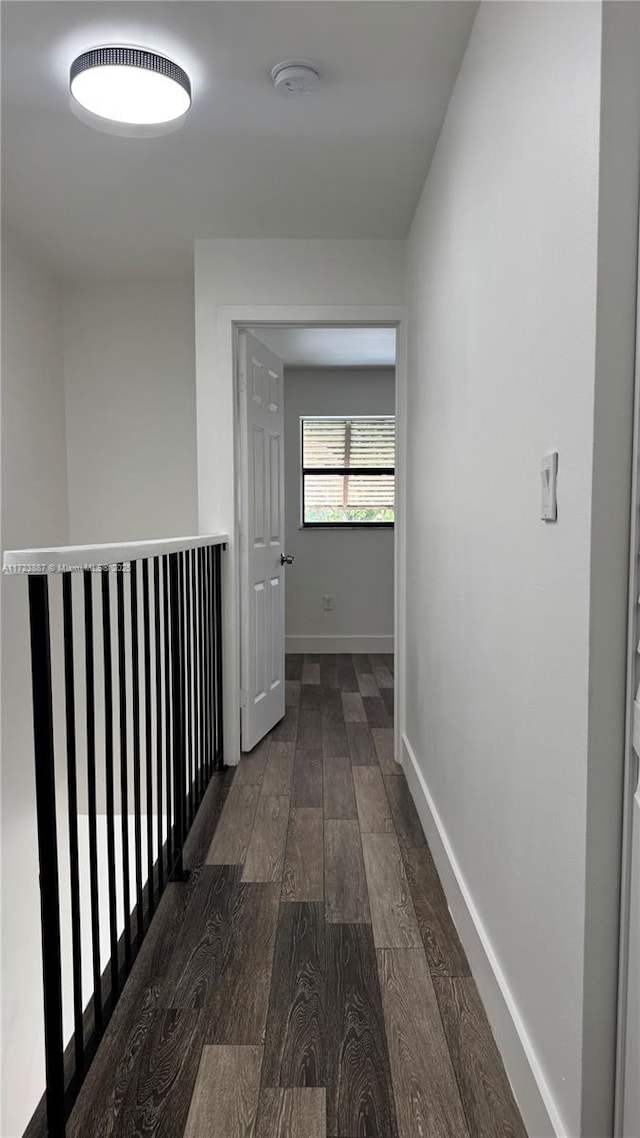 6850 NW 173rd Dr Unit 103, Hialeah, FL 33015 - hallway featuring dark wood-style floors and baseboards