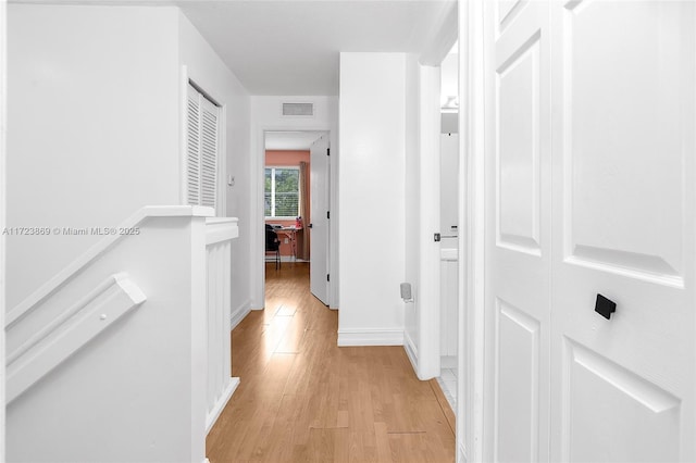 hall with light hardwood / wood-style flooring