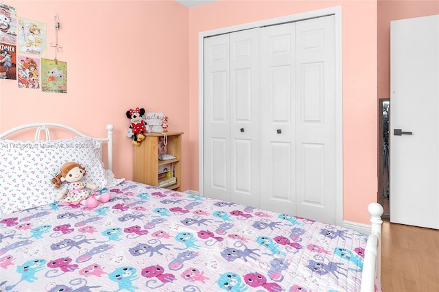 bedroom featuring a closet and hardwood / wood-style floors