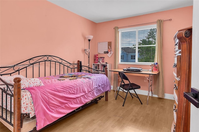 bedroom featuring wood-type flooring