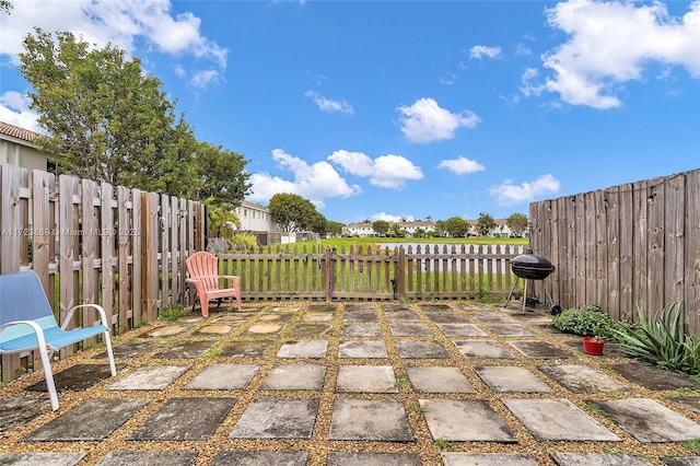 view of patio featuring a grill