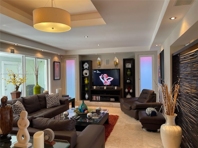 living room with a tray ceiling