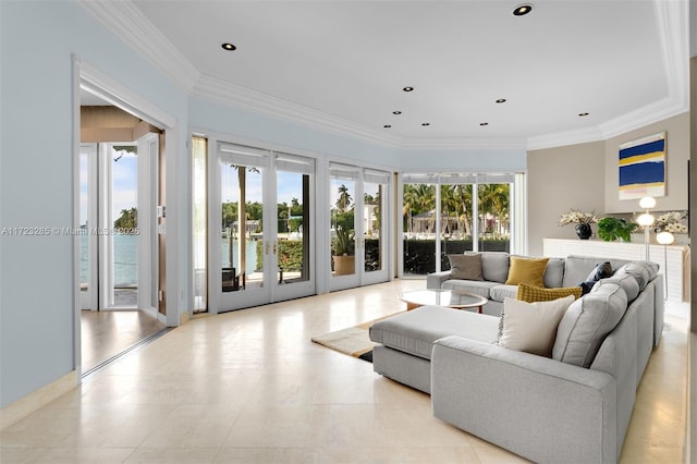 living room featuring a water view and ornamental molding