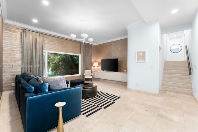 living room with crown molding and an inviting chandelier