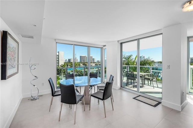 dining space featuring expansive windows