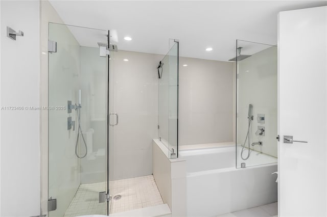 bathroom with shower with separate bathtub