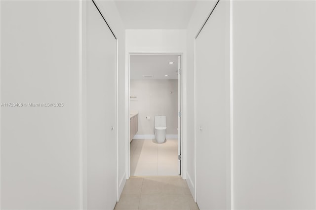 hallway with light tile patterned flooring