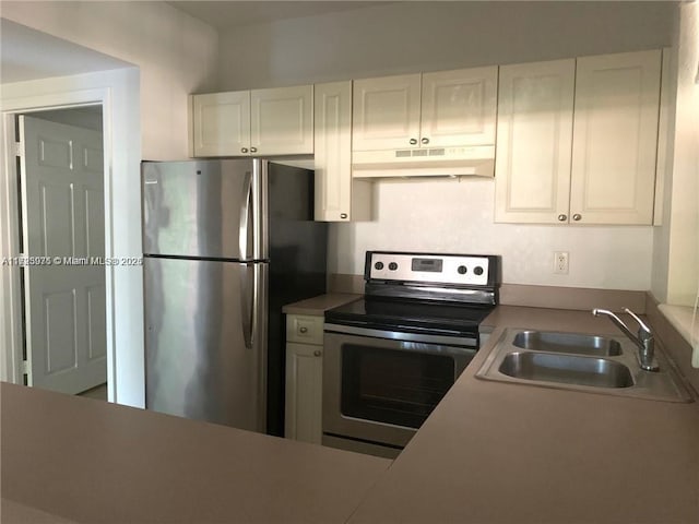 kitchen featuring sink, white cabinetry, and stainless steel appliances