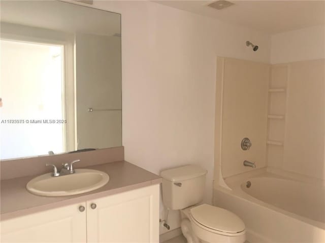 full bathroom with vanity, toilet, and bathtub / shower combination