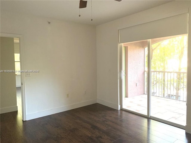 unfurnished room featuring ceiling fan and dark wood-type flooring