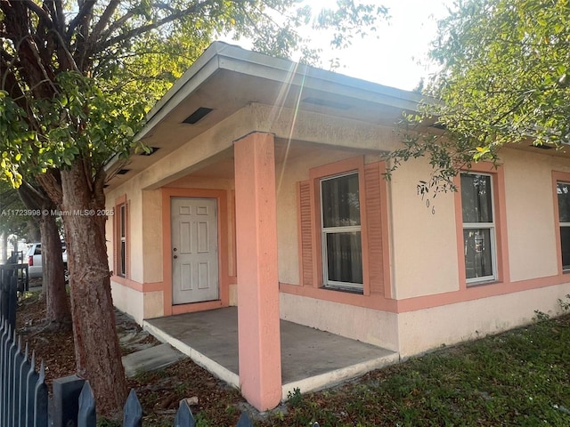 view of side of home with a patio