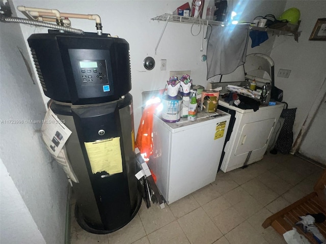 utility room with separate washer and dryer