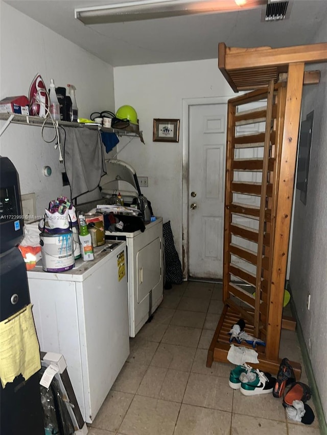 laundry area with washing machine and dryer