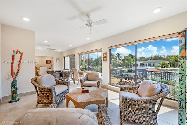 living room featuring ceiling fan and light tile patterned floors