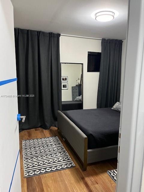 bedroom featuring hardwood / wood-style floors