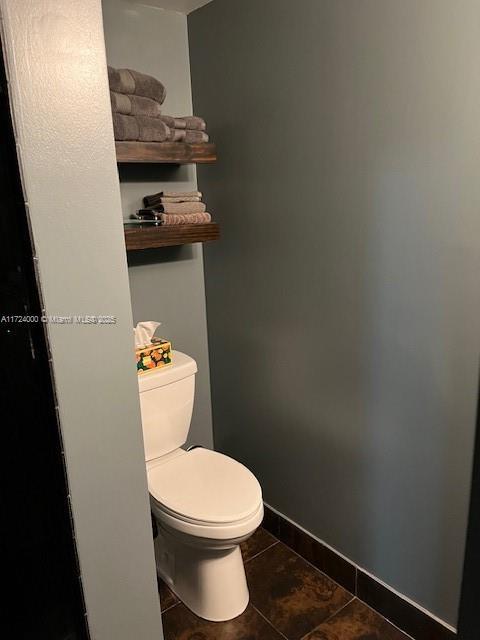 bathroom with tile patterned floors and toilet