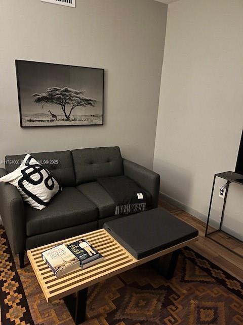 living room featuring dark hardwood / wood-style flooring