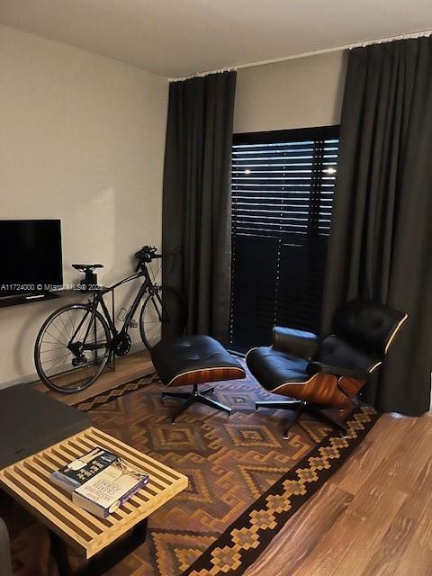 living area featuring hardwood / wood-style floors