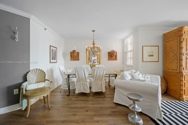 dining room with a chandelier, dark wood-type flooring, and crown molding