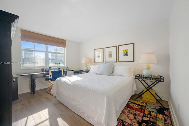 bedroom with light wood-type flooring