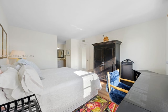 bedroom featuring wood-type flooring