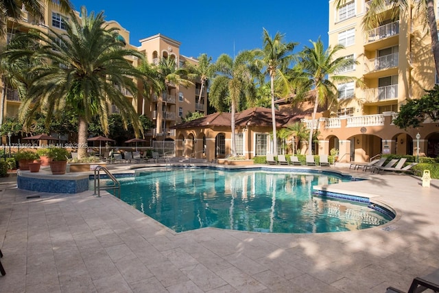 view of swimming pool featuring a patio area