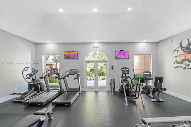 exercise room with french doors and a healthy amount of sunlight