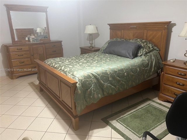 bedroom with light tile patterned floors