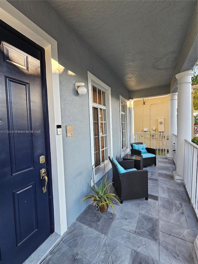 doorway to property with a porch