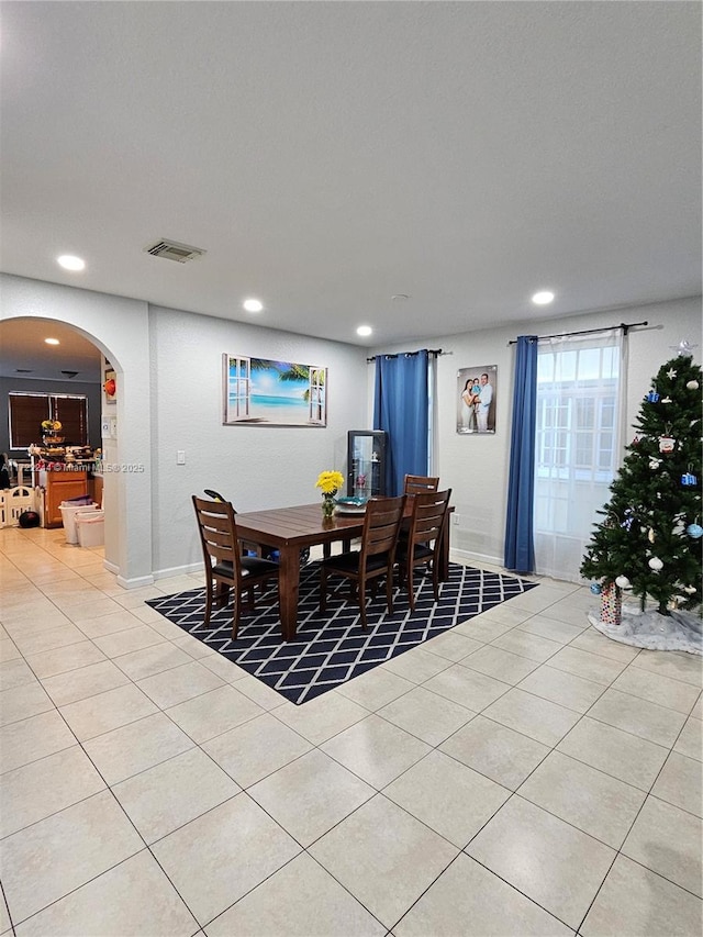 dining space with light tile patterned floors