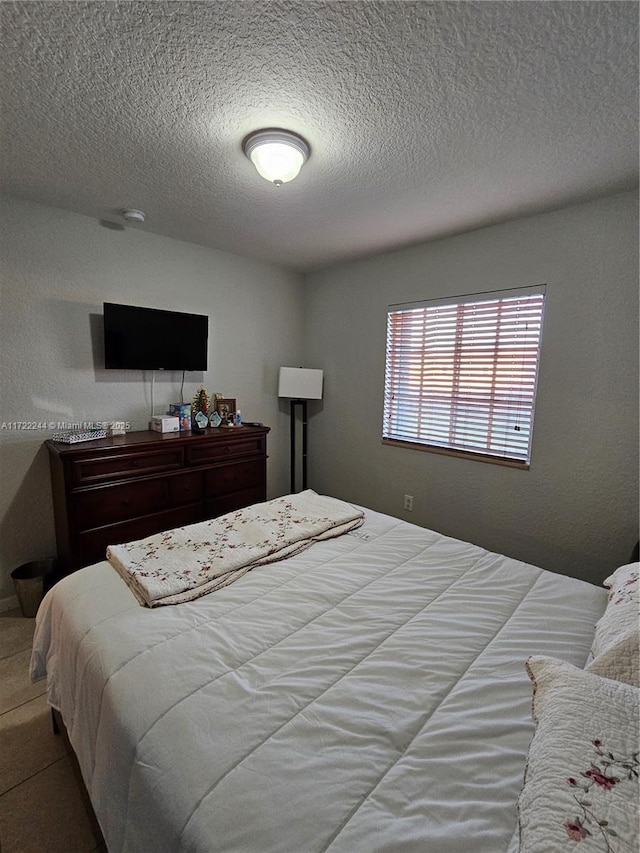 bedroom featuring a textured ceiling