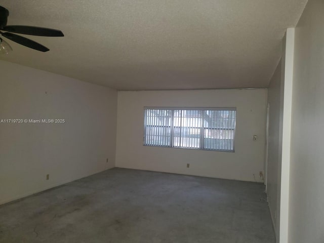 unfurnished room featuring a textured ceiling and ceiling fan