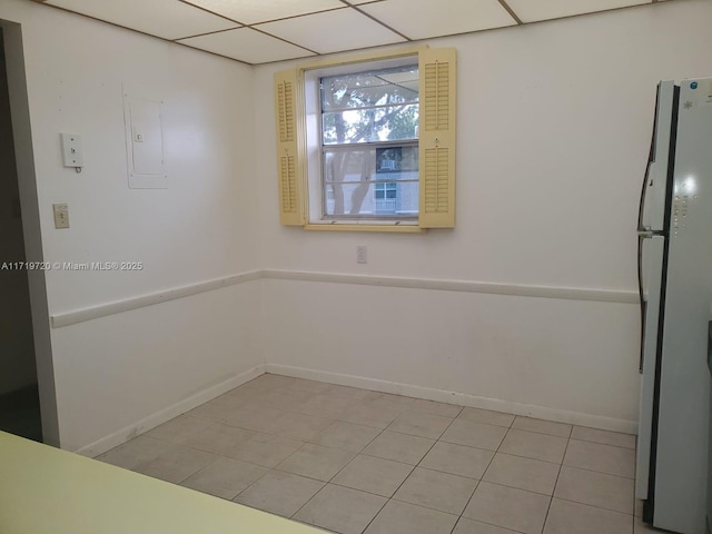 spare room featuring light tile patterned flooring