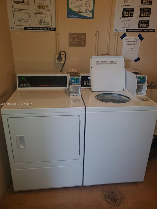 laundry room with washing machine and clothes dryer