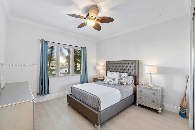 bedroom with light hardwood / wood-style flooring, ceiling fan, and crown molding