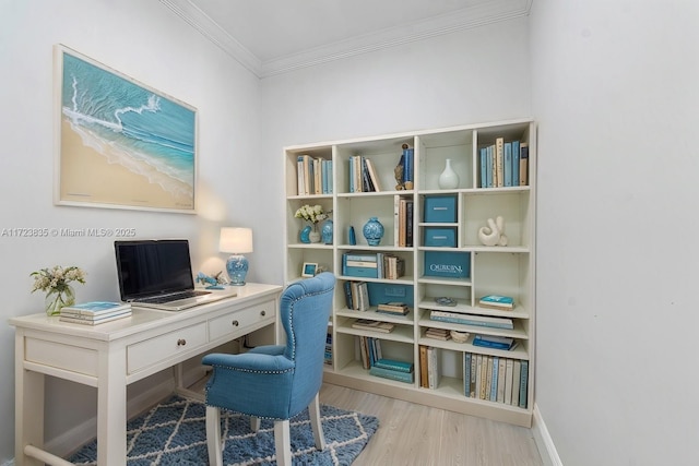 office space featuring light wood-type flooring and crown molding