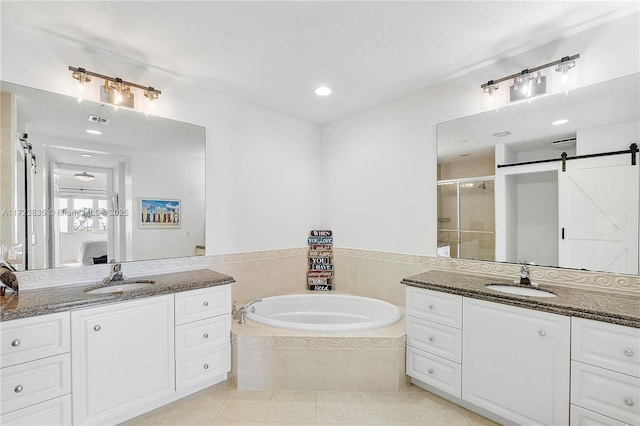 bathroom featuring separate shower and tub, tile patterned floors, and vanity