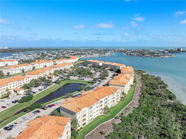 birds eye view of property with a water view