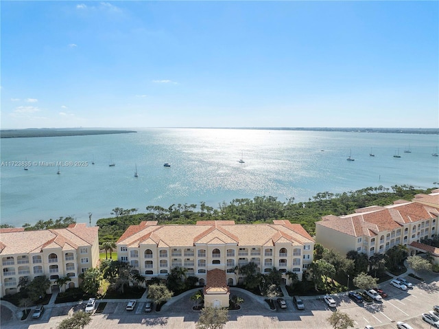 birds eye view of property with a water view