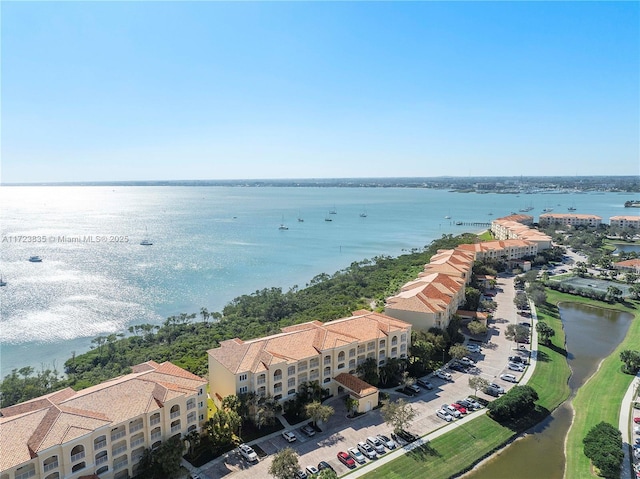 drone / aerial view with a water view