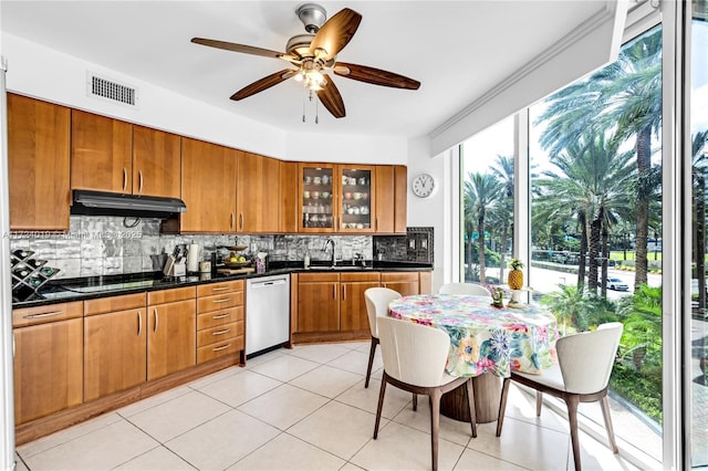 kitchen featuring sink, dishwasher, backsplash, and black cooktop