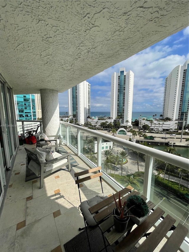 balcony featuring a water view