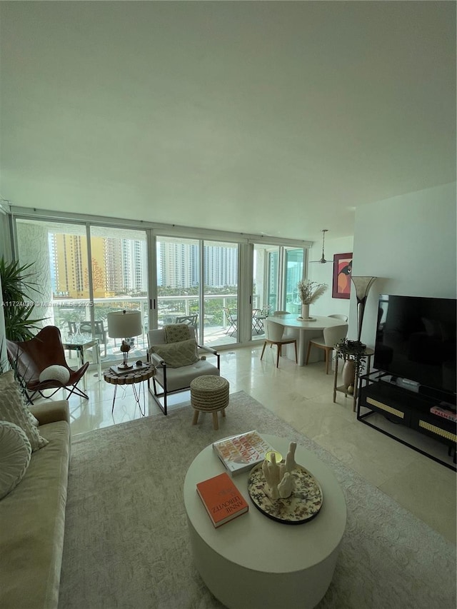 living room featuring floor to ceiling windows