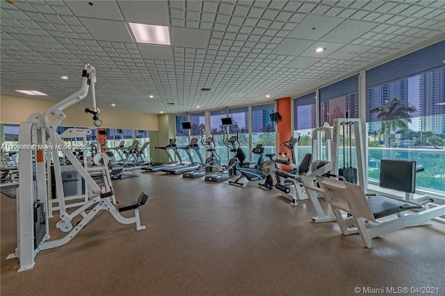 exercise room with floor to ceiling windows