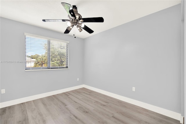 spare room featuring ceiling fan and light hardwood / wood-style flooring