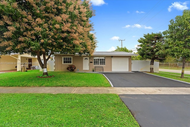 view of front facade with a front lawn and a garage