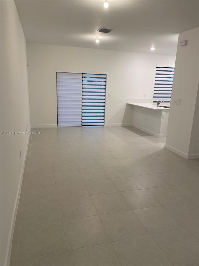 tiled spare room with built in desk