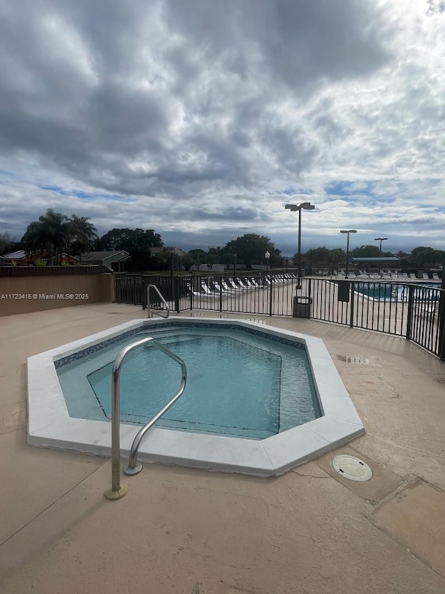 view of swimming pool featuring a patio area