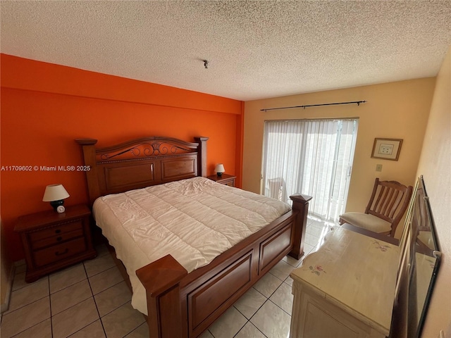 tiled bedroom with a textured ceiling